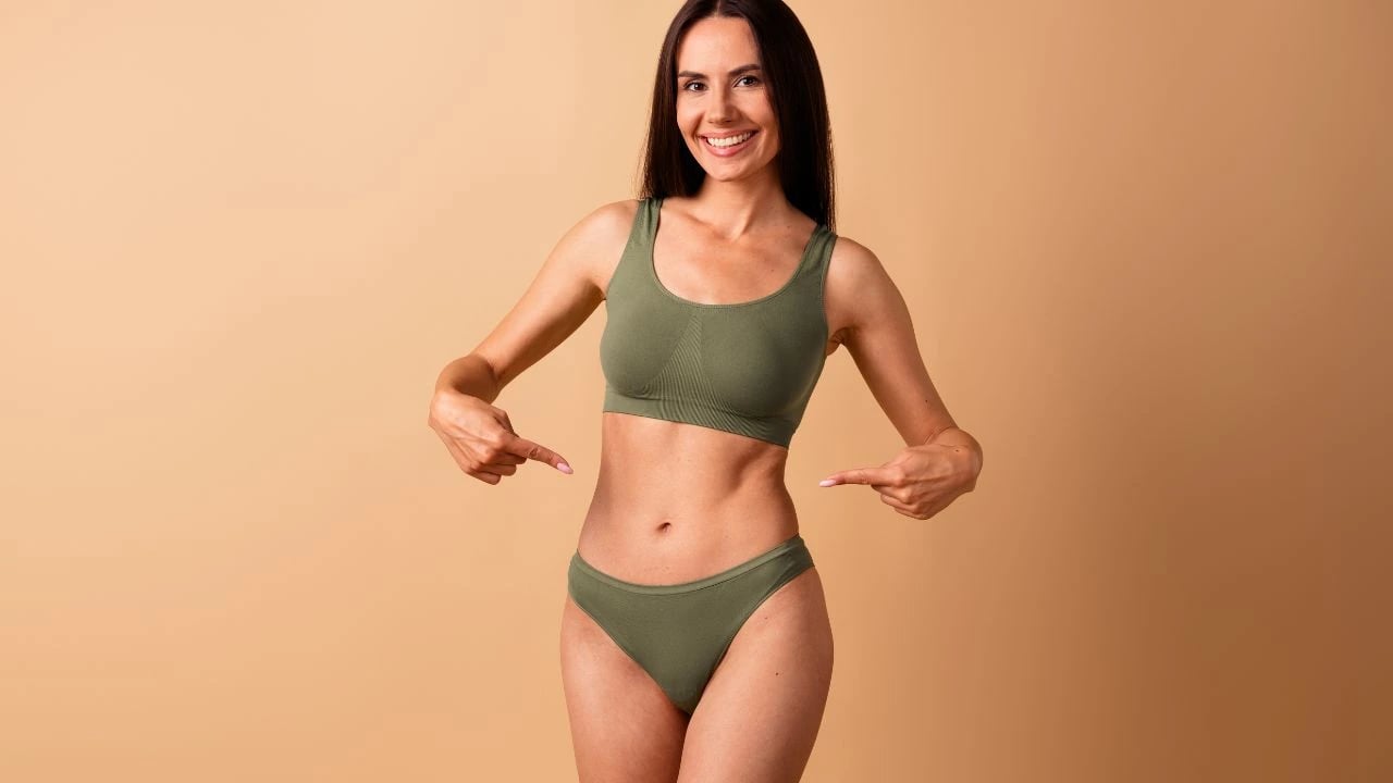 stunning woman showing thin waist abdominal muscles stunning woman showing thin waist abdominal muscles
